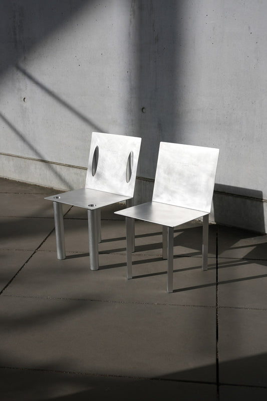 master & margarita 2-in-1 chair — the pair on a concrete terrace · studio von schoenebeck · collectible design at spazio