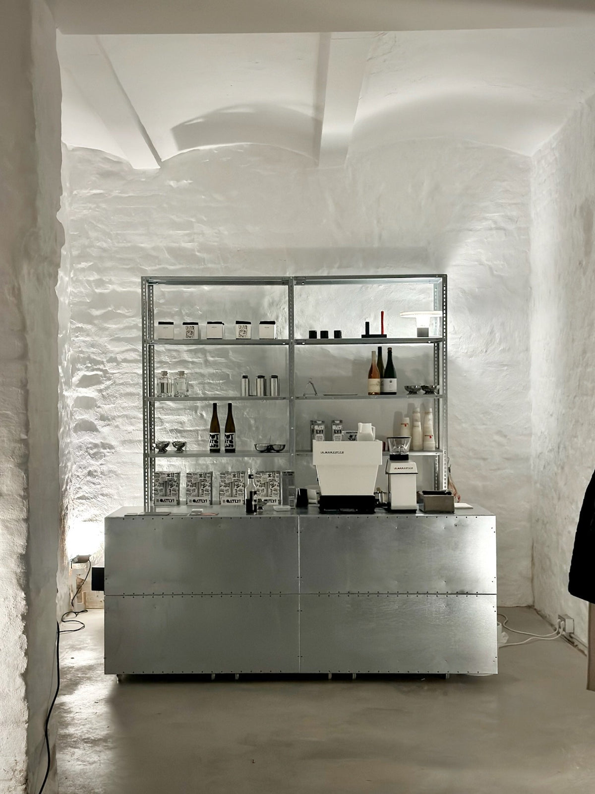 steel shelf bar in the vaulted room, spazio Munich